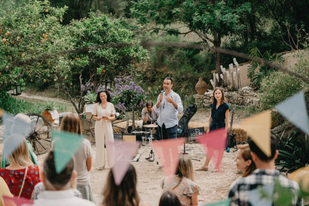Group gathered for a speech in a garden