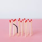 Matches lined together with only one burnt out.