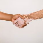 Two people shaking hands.