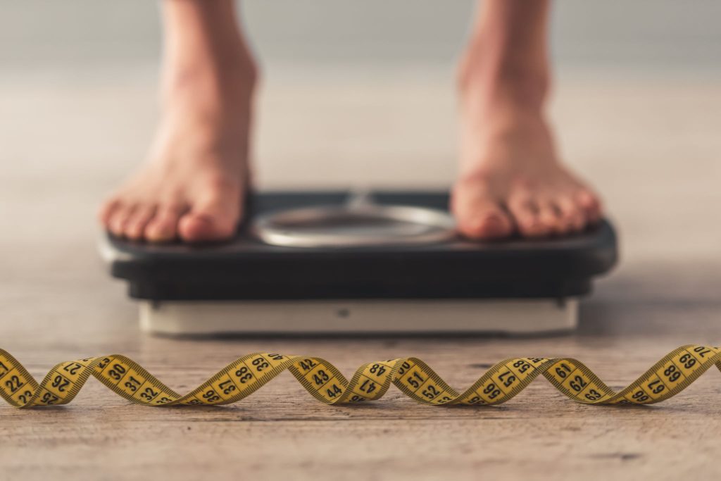 Person obsessed with weight loss, anorexia symptom